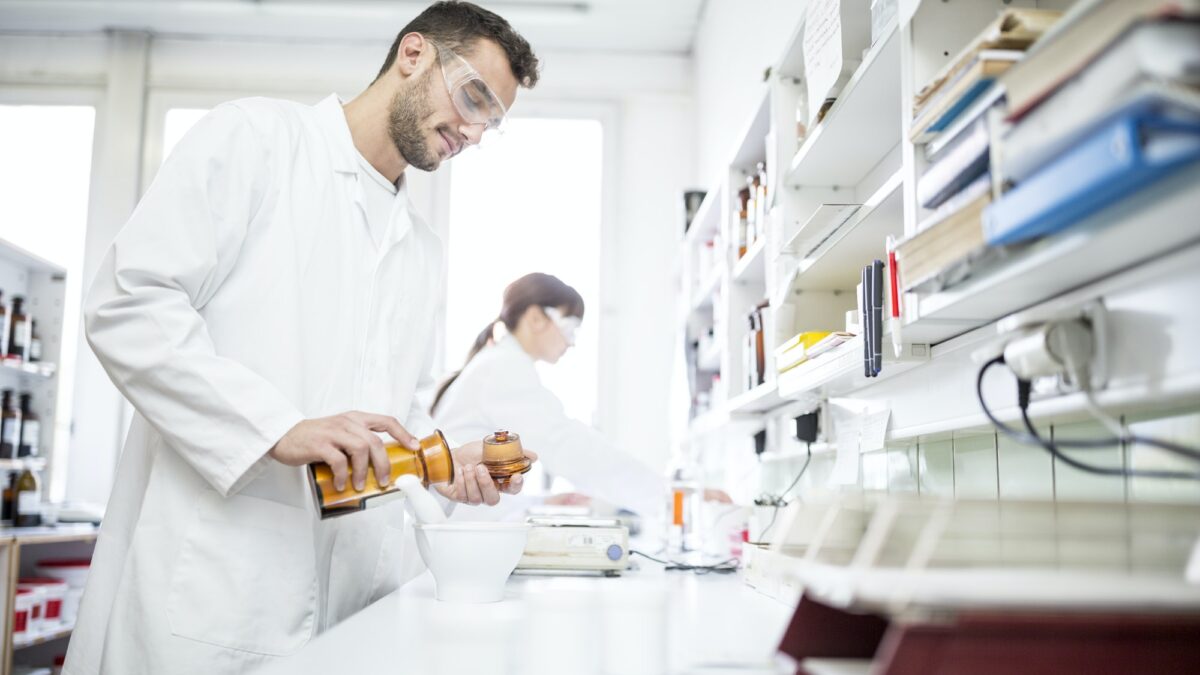Man and woman working in laboratory of a pharmacy