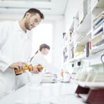 Man and woman working in laboratory of a pharmacy
