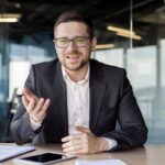 Portrait of a young businessman, a business coach conducts training and online training